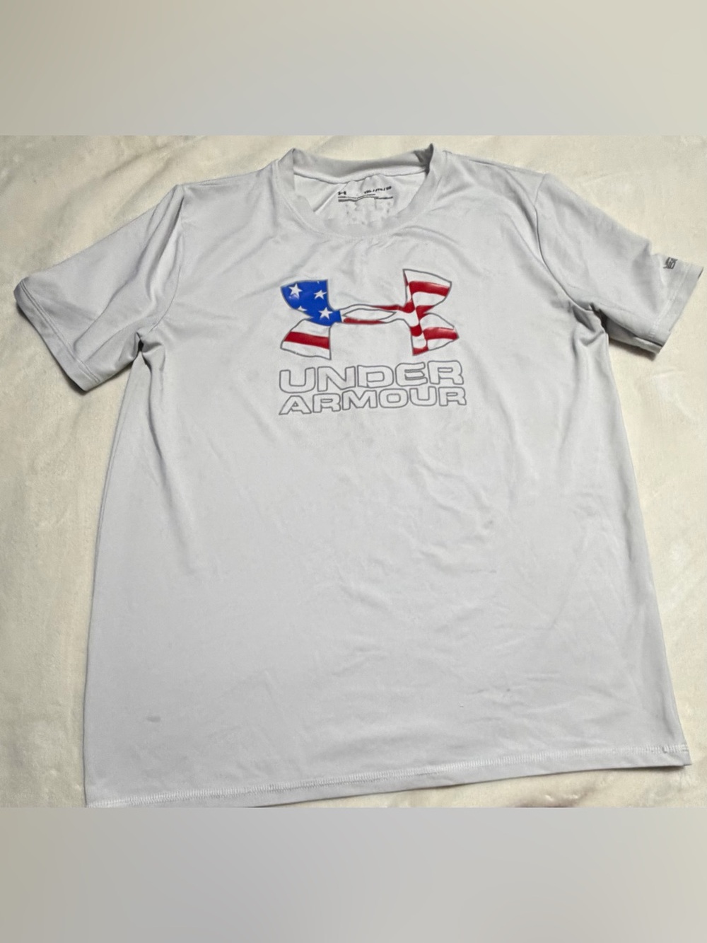 Under Armour White Short Sleeve Tee with Red, Blue & White Flag Logo